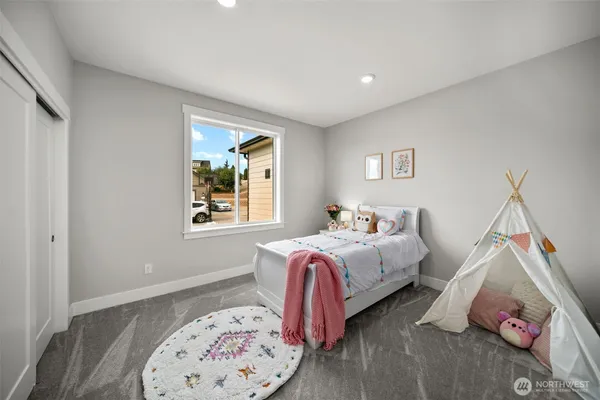 a bedroom with bed and a window