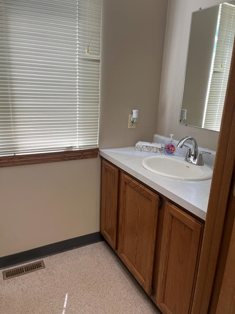 823 West Spring Street Titusville, PA 16354 - Photo 17 of 43 a bathroom with a sink and a mirror