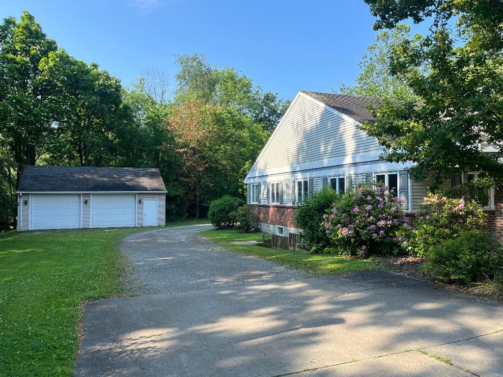 823 West Spring Street Titusville, PA 16354 - Photo 2 of 43 a view of a house with yard and a garden