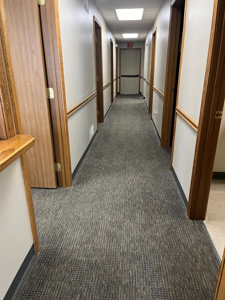 823 West Spring Street Titusville, PA 16354 - Photo 28 of 43 a view of a hallway with wooden floor and staircase