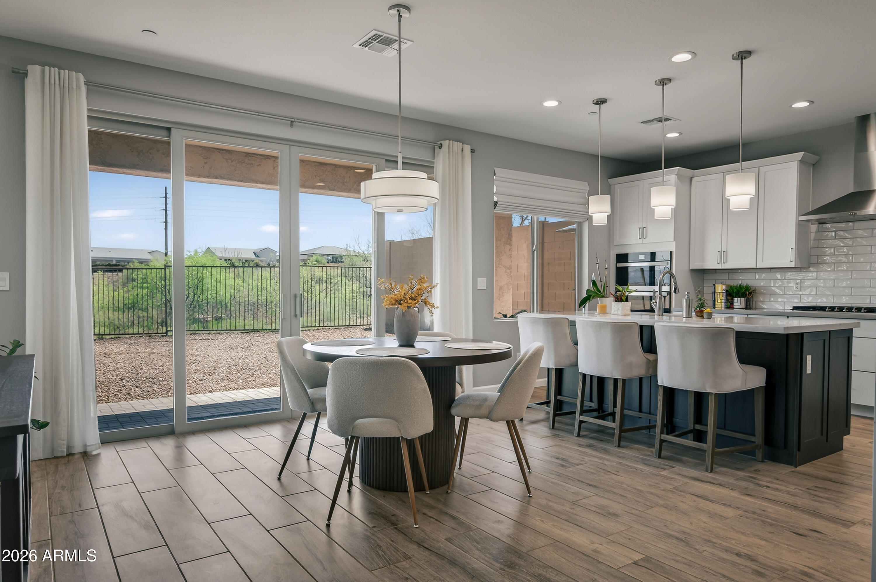495 Cleopatra Hill Road Clarkdale, AZ 86324 - Photo 11 of 33 a view of a dining room with furniture window and wooden floor
