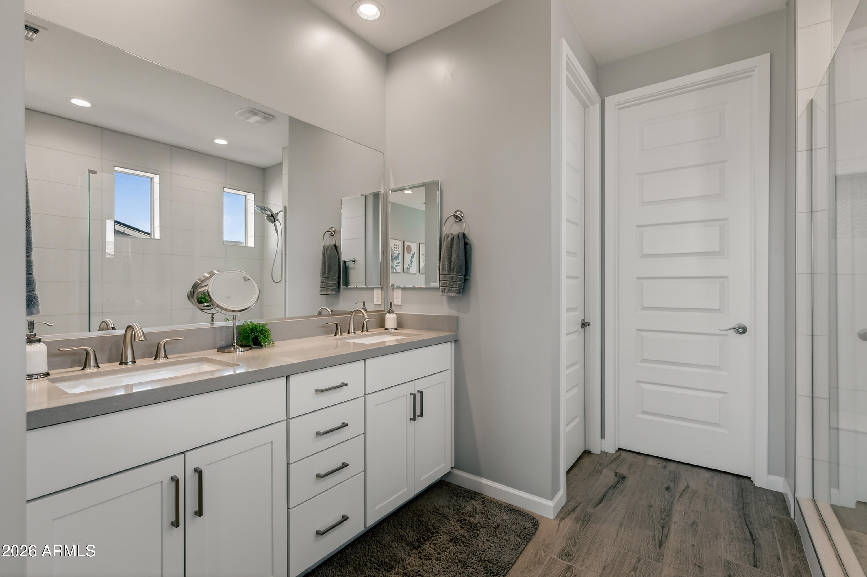 495 Cleopatra Hill Road Clarkdale, AZ 86324 - Photo 18 of 33 a spacious bathroom with a double vanity sink a mirror and a shower