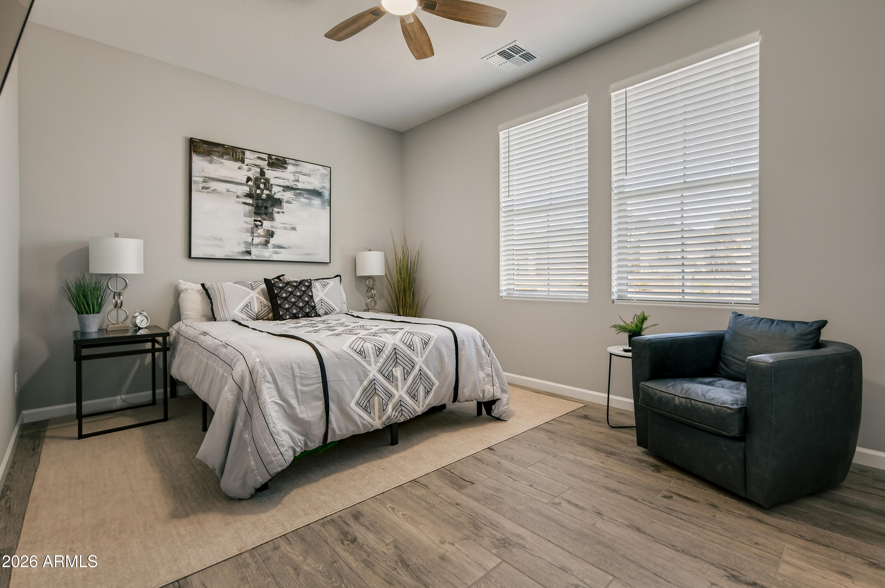 495 Cleopatra Hill Road Clarkdale, AZ 86324 - Photo 21 of 33 a bedroom with bed couch and window