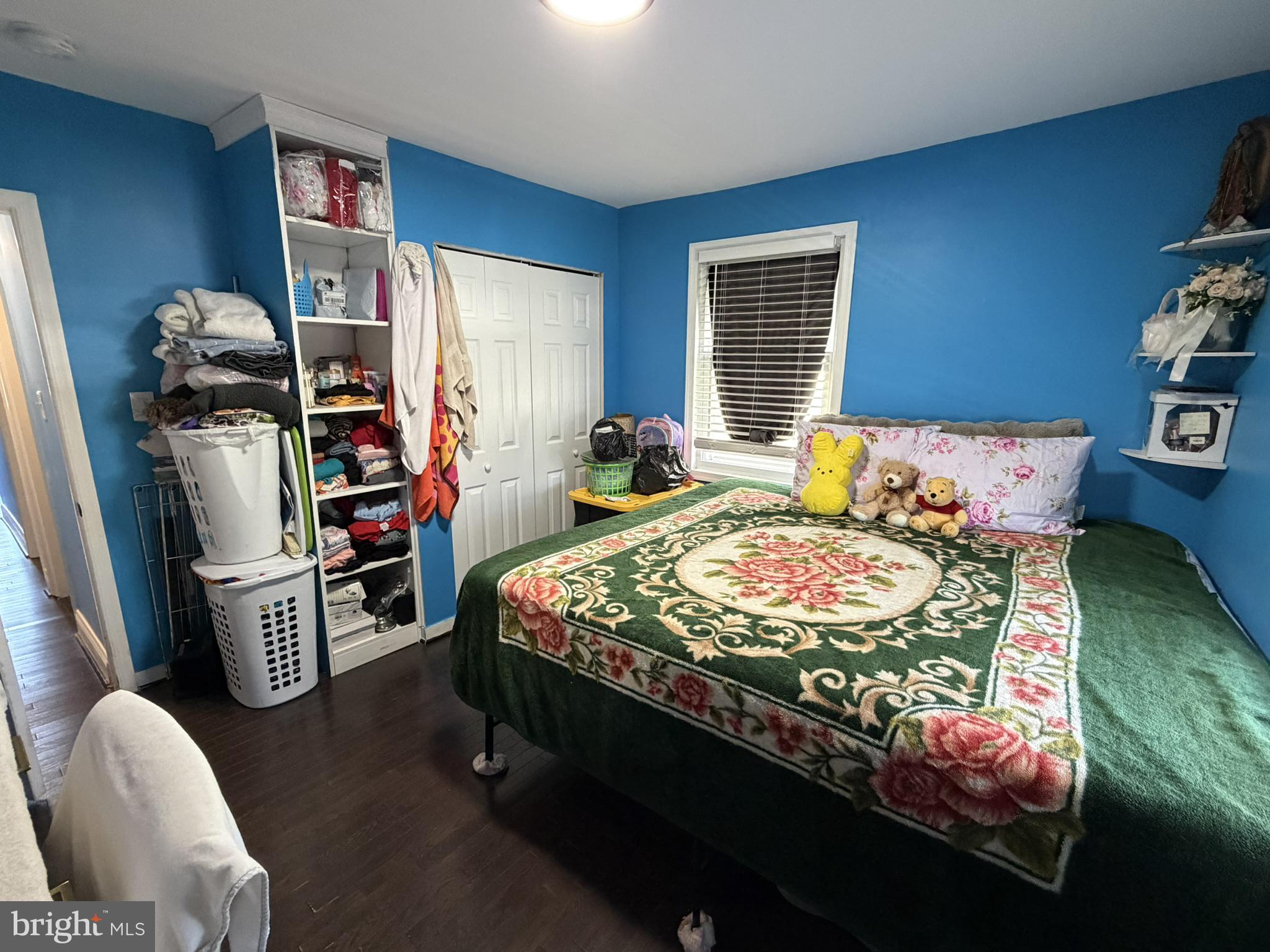 203 Sollers Point Road Dundalk, MD 21222 - Photo 10 of 16 Cozy bedroom with vibrant blue walls.