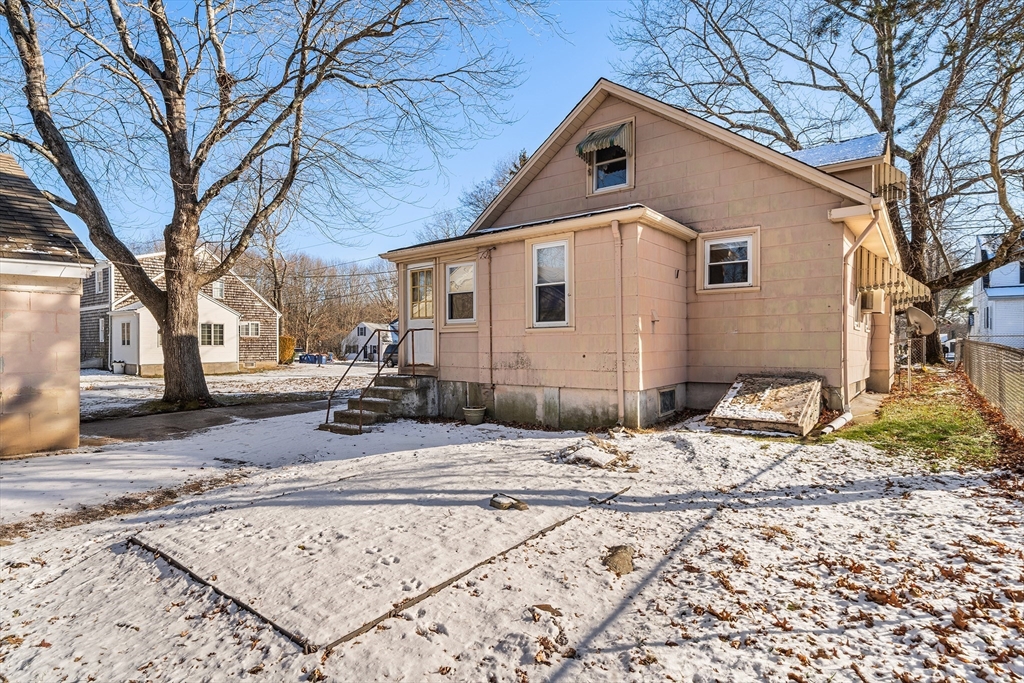 90 Ellis Street Seekonk, MA 02771 - Photo 11 of 12 a view of a white house with a large tree