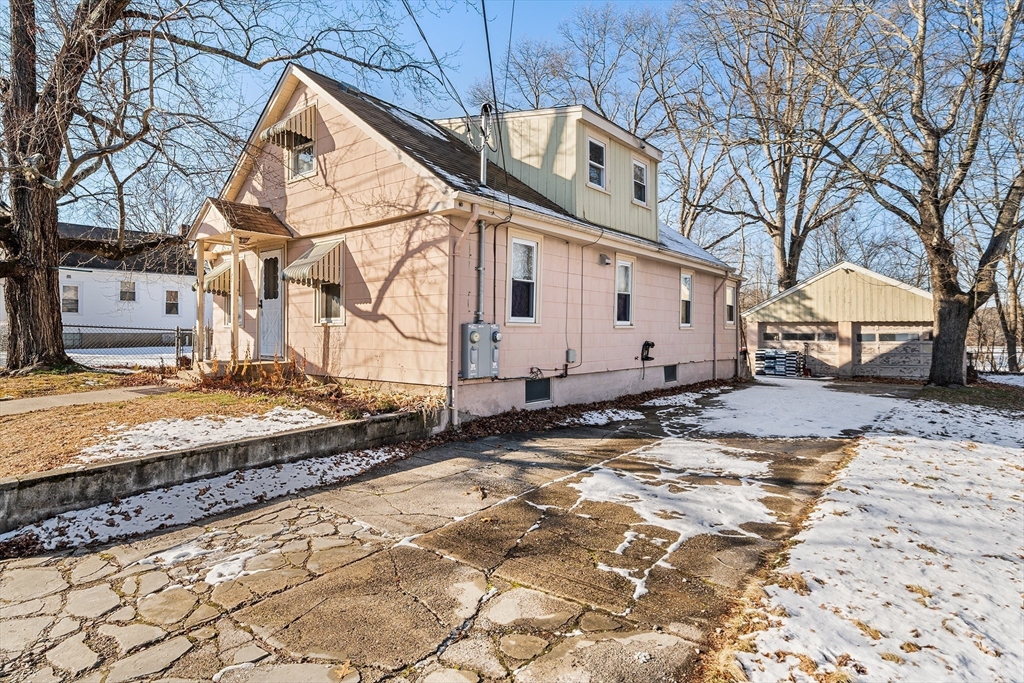 90 Ellis Street Seekonk, MA 02771 - Photo 4 of 12 a view of a white house with a large tree in front of it