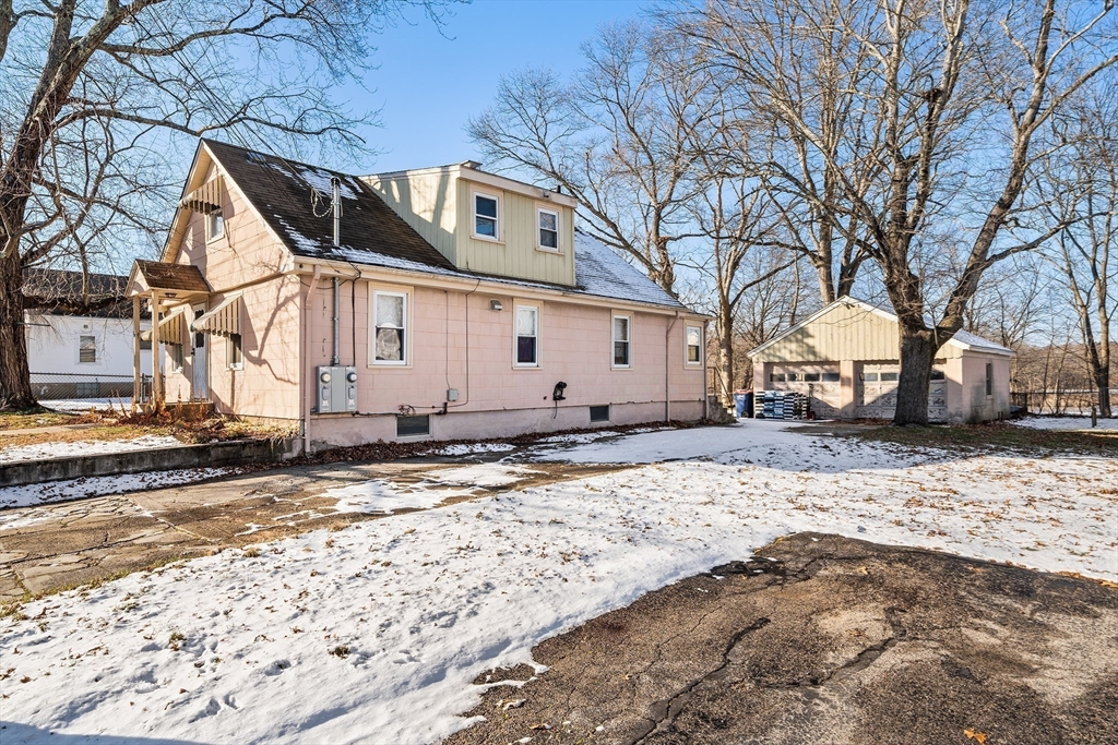 90 Ellis Street Seekonk, MA 02771 - Photo 5 of 12 a view of a white house with a snow on the road
