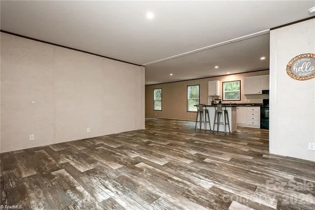 a view of kitchen with furniture and wooden floor