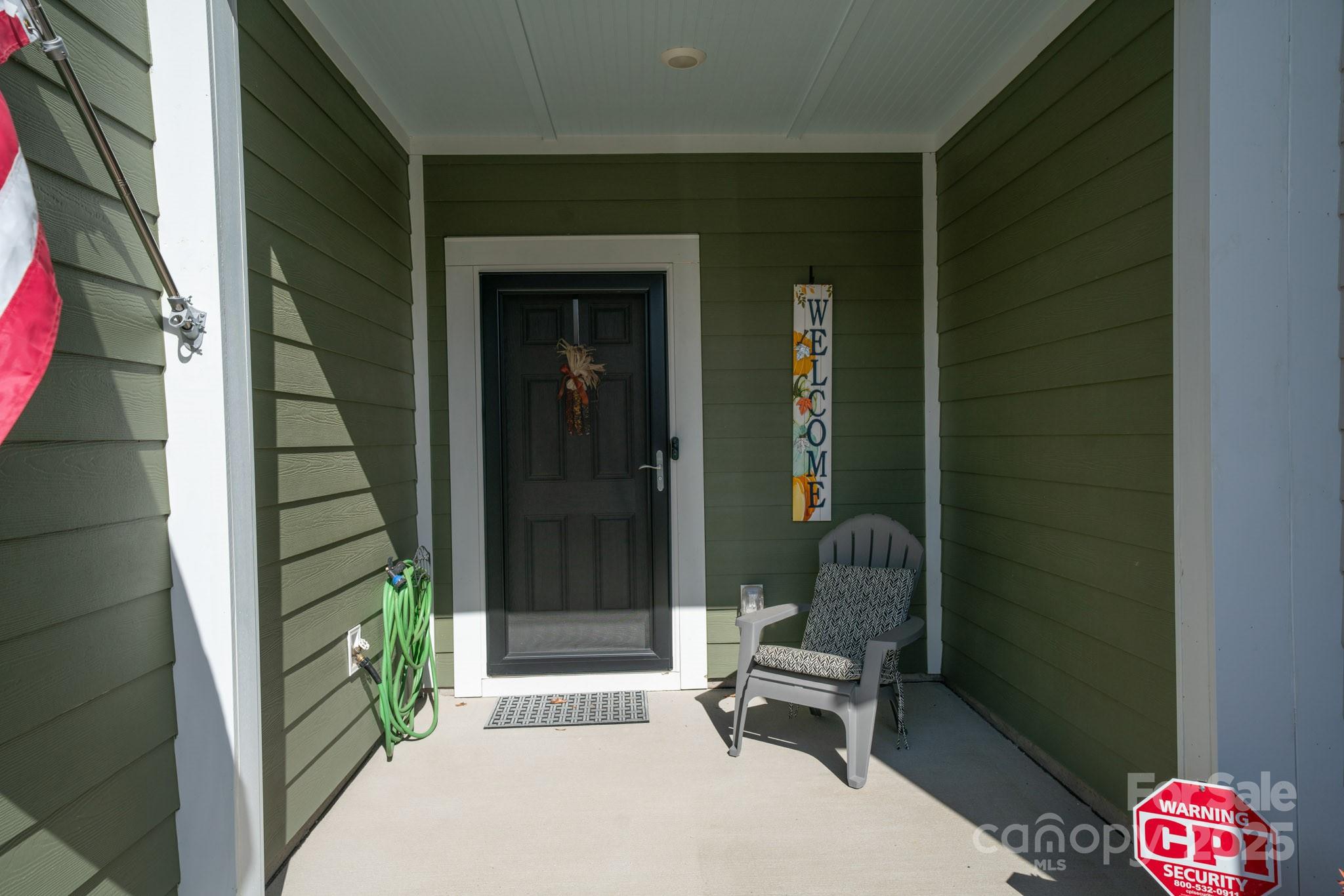 a bench sitting in front of a door