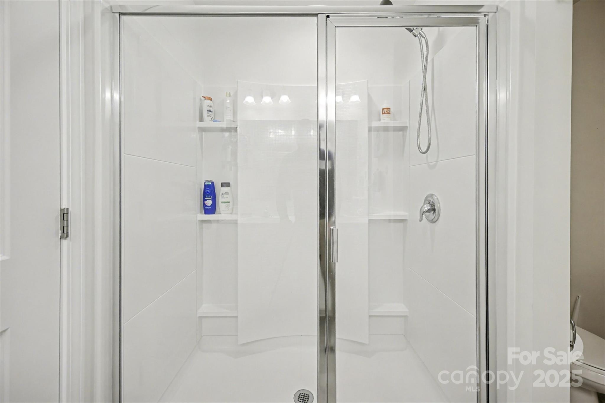 226 Quinn Road Matthews, NC 28104 - Photo 22 of 30 a bathroom with a shower