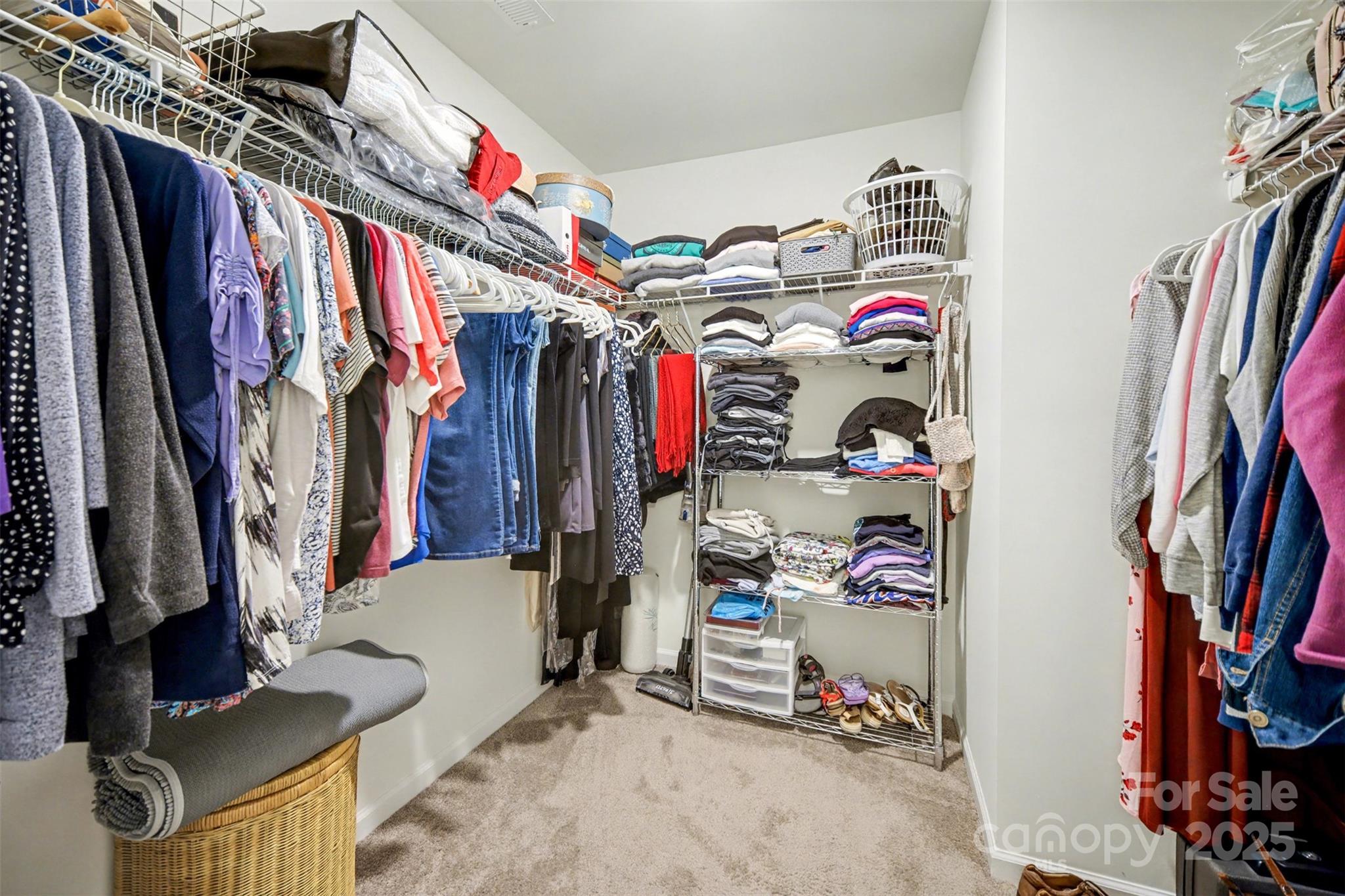 226 Quinn Road Matthews, NC 28104 - Photo 23 of 30 a view of walk in closet with clothes