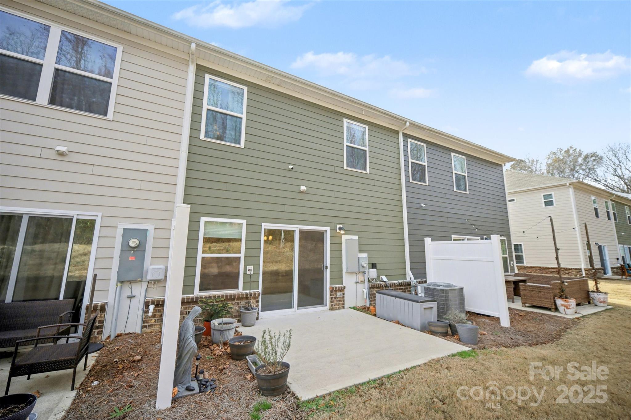 226 Quinn Road Matthews, NC 28104 - Photo 30 of 30 a view of a house with a patio