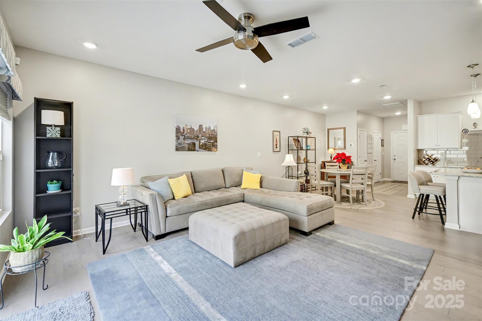 226 Quinn Road Matthews, NC 28104 - Photo 7 of 30 a living room with furniture and kitchen view