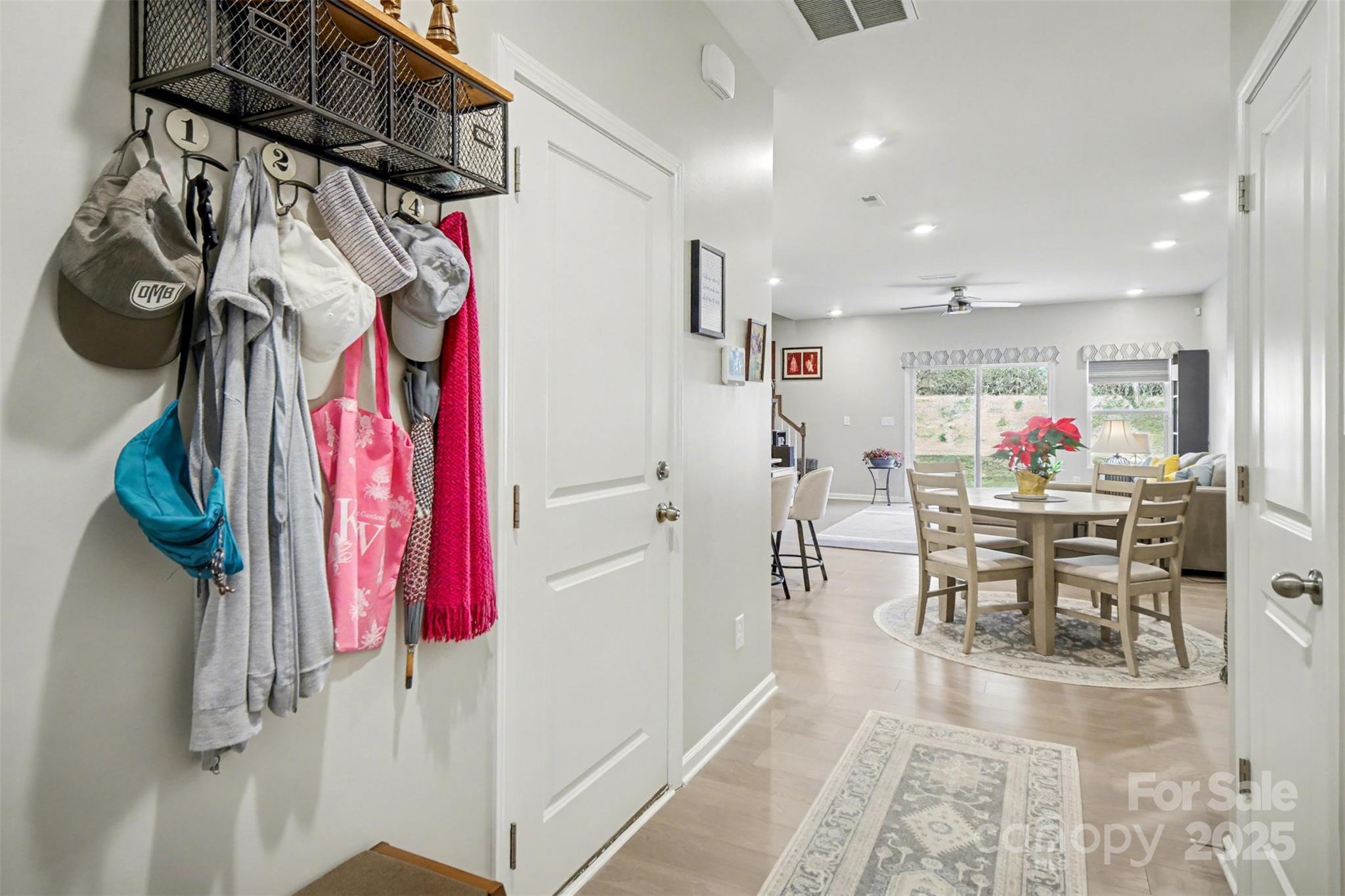 226 Quinn Road Matthews, NC 28104 - Photo 8 of 30 a view of a dining hall with a dining table chairs and entryway