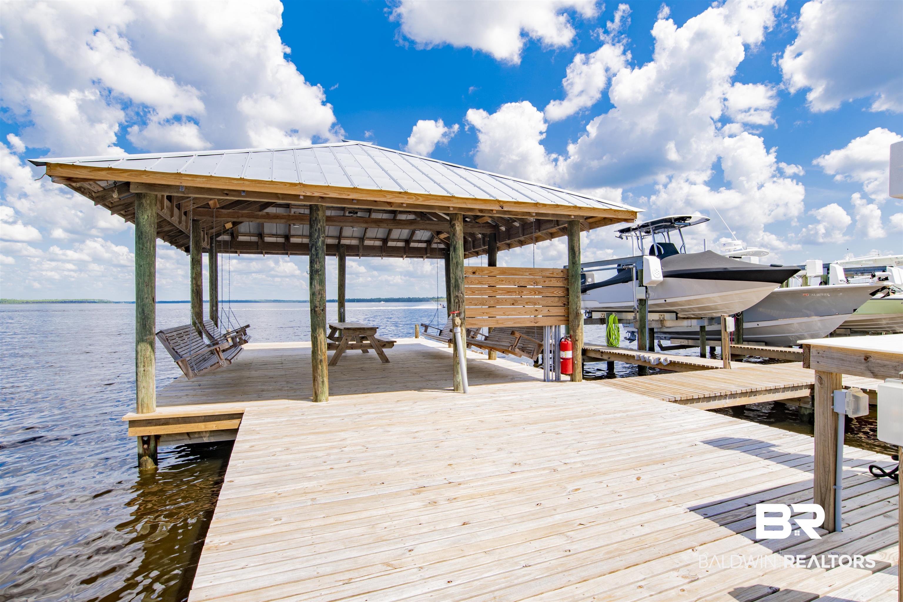 25773 Canal Road, Unit 38 Orange Beach, AL 36561 - Photo 29 of 38 View of dock featuring a water view