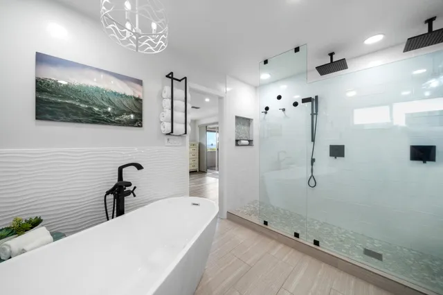 a bathroom with a bathtub and a shower