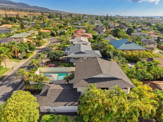 an aerial view of a house with a garden