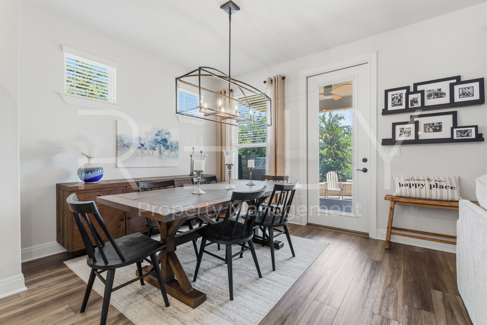 101 Spanish Star Street Georgetown, TX 78633 - Photo 20 of 39 Durable plank flooring and large windows complement this spacious dining area with outdoor access.