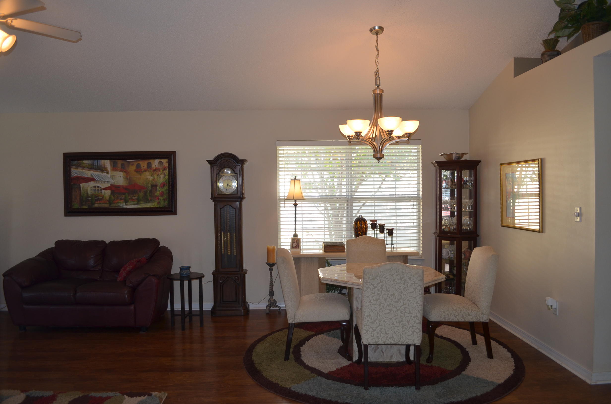669 East Shipwreck Road Santa Rosa Beach, FL 32459 - Photo 12 of 35 a living room with furniture and a chandelier