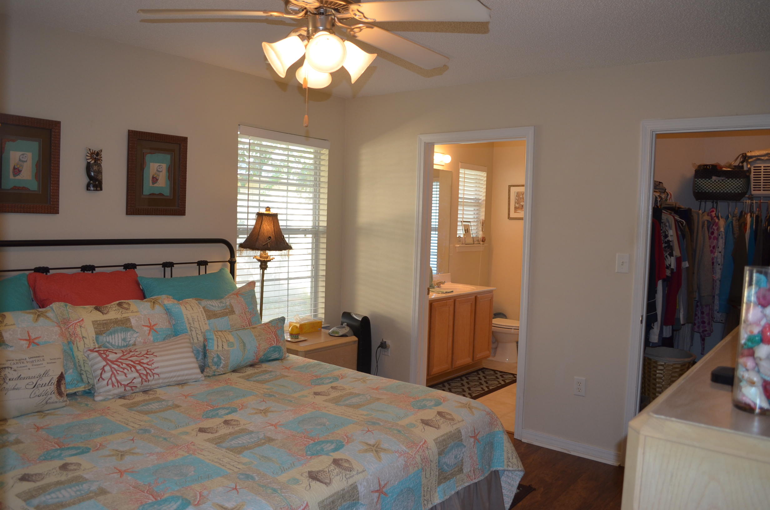 669 East Shipwreck Road Santa Rosa Beach, FL 32459 - Photo 15 of 35 a bedroom with bed and wooden floor