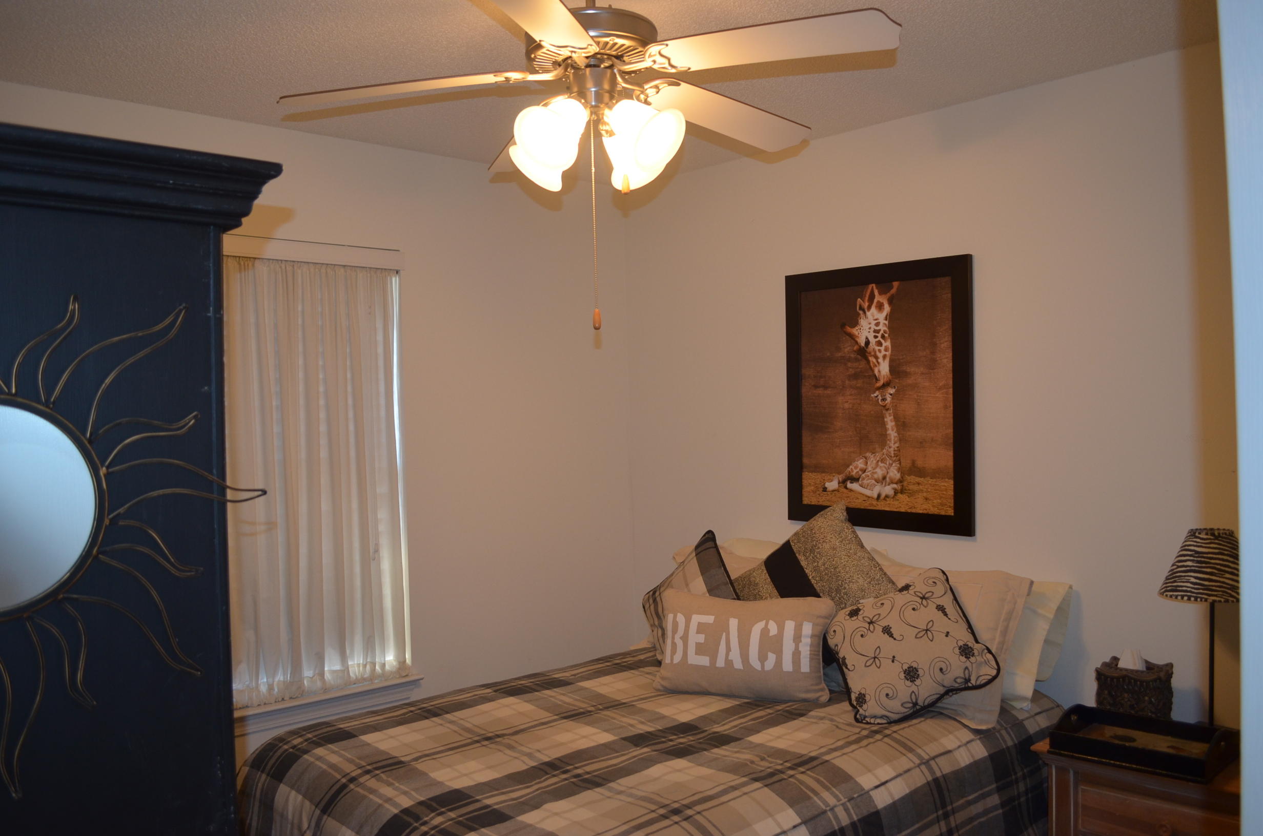 669 East Shipwreck Road Santa Rosa Beach, FL 32459 - Photo 22 of 35 a bedroom with a bed and window