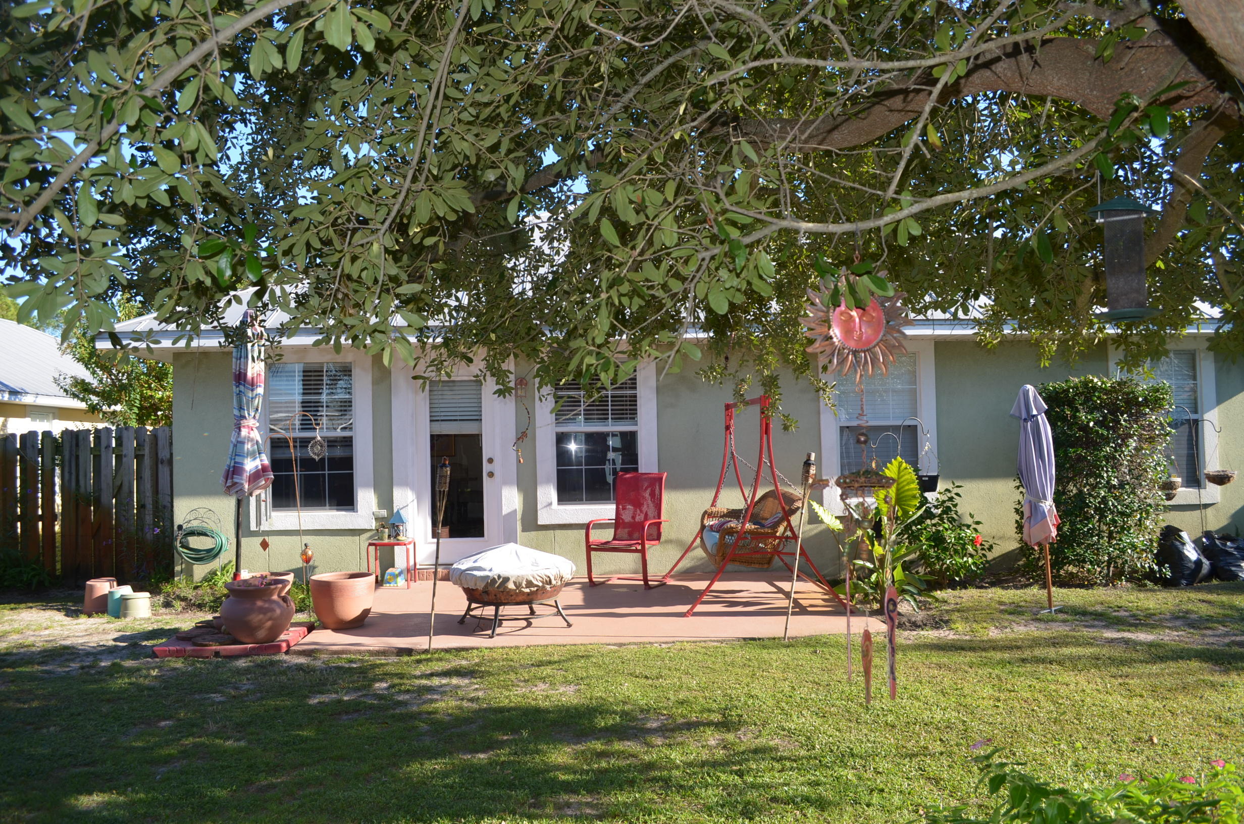 669 East Shipwreck Road Santa Rosa Beach, FL 32459 - Photo 28 of 35 a front view of a house with a garden and tree