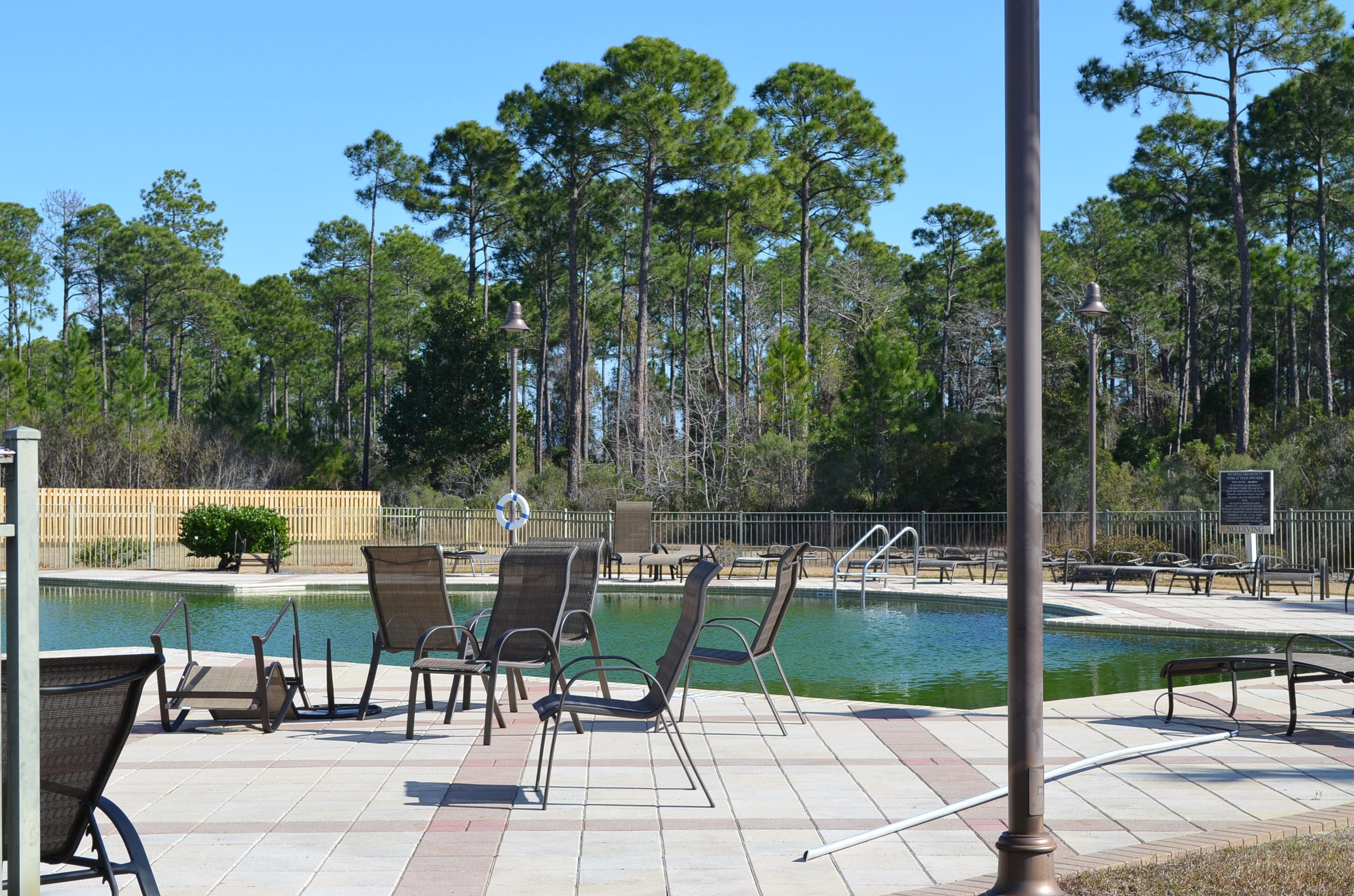 669 East Shipwreck Road Santa Rosa Beach, FL 32459 - Photo 31 of 35 a view of chairs and tables in a patio