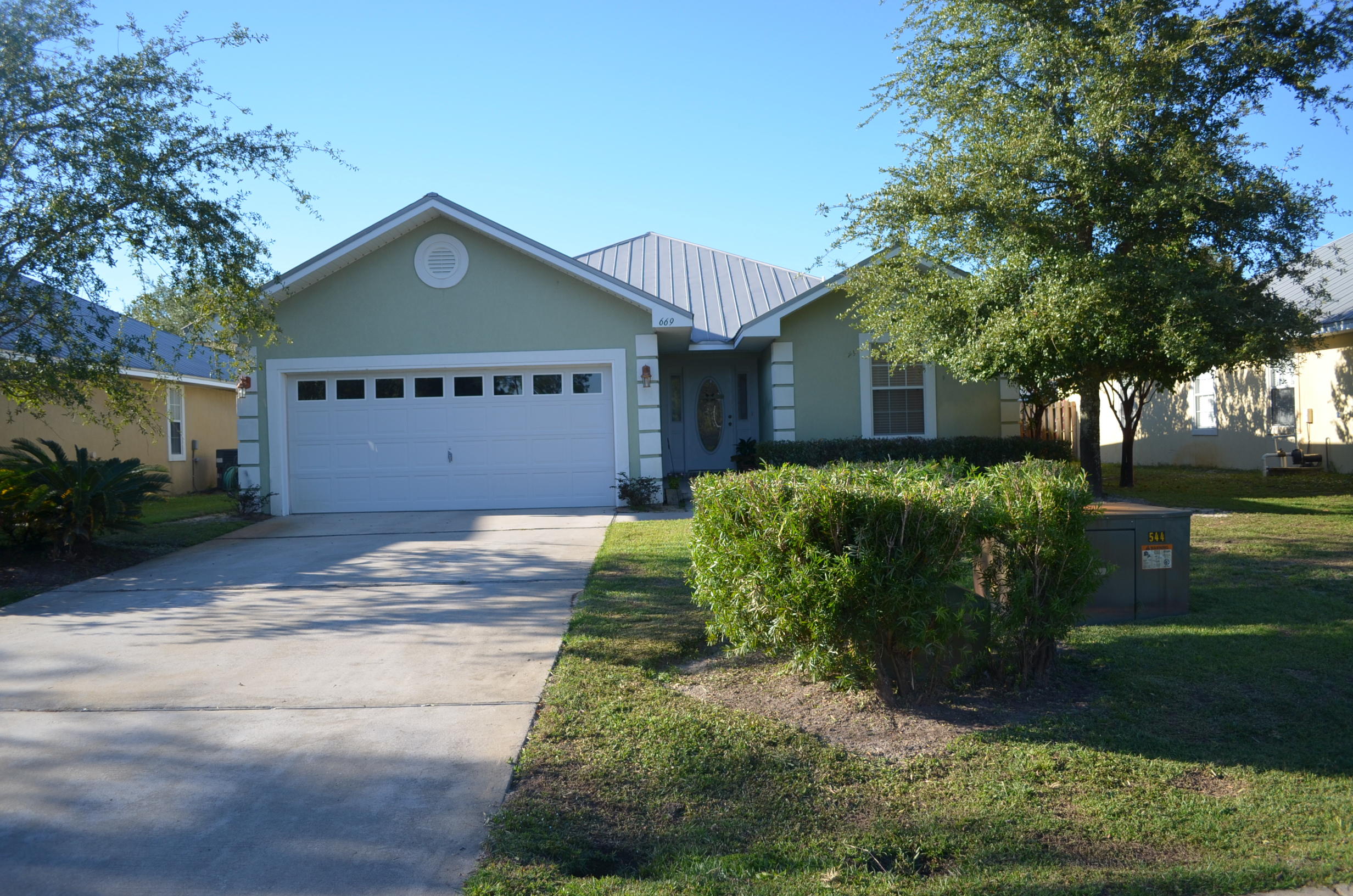 669 East Shipwreck Road Santa Rosa Beach, FL 32459 - Photo 32 of 35 a front view of a house with a yard