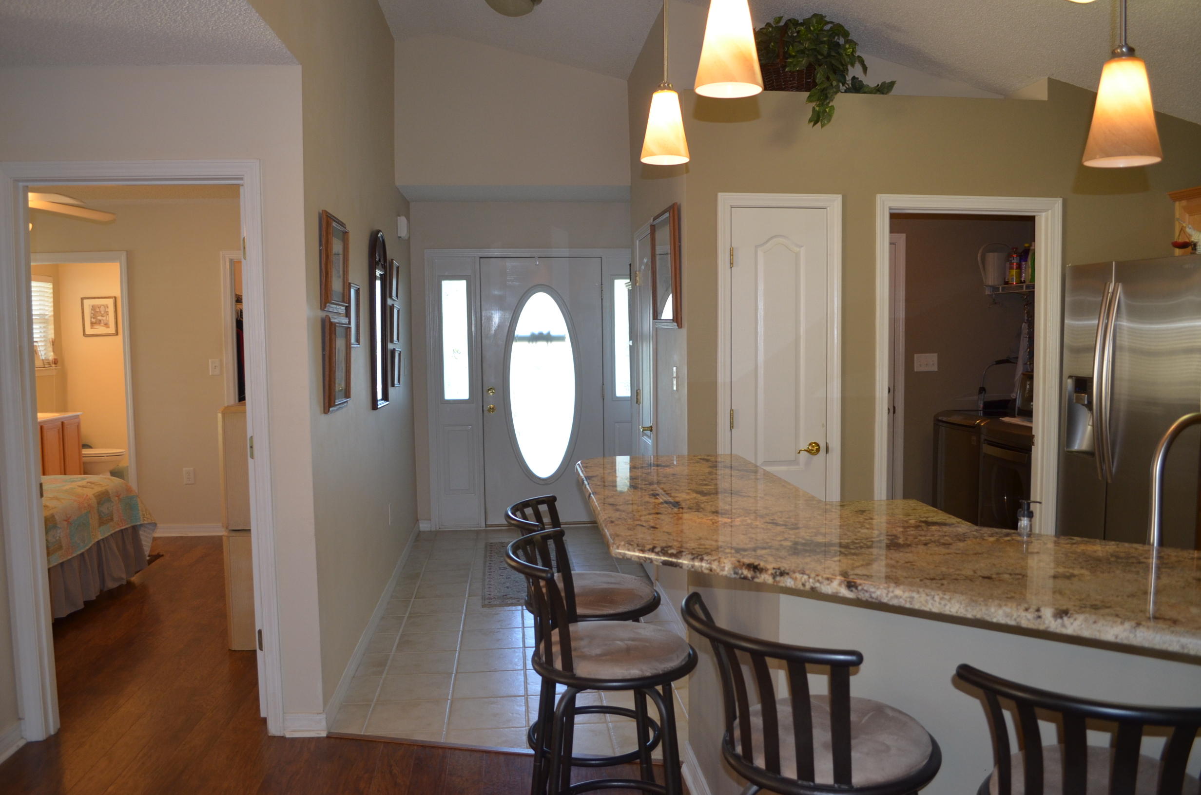 669 East Shipwreck Road Santa Rosa Beach, FL 32459 - Photo 4 of 35 a bathroom with a granite countertop sink a mirror and a vanity