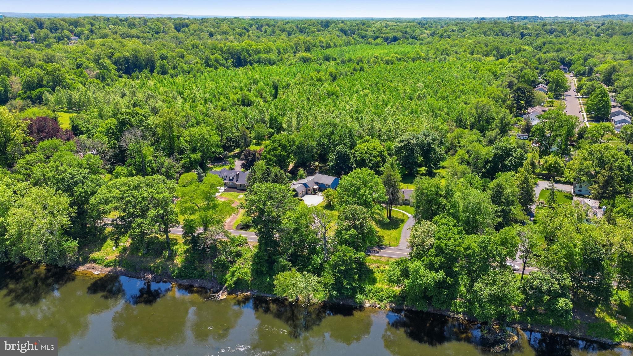 621 River Road Yardley, PA 19067 - Photo 68 of 75 a view of a lake with a house in the background