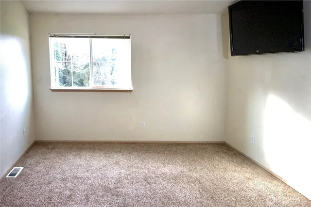 a backyard of a house with lots of green space