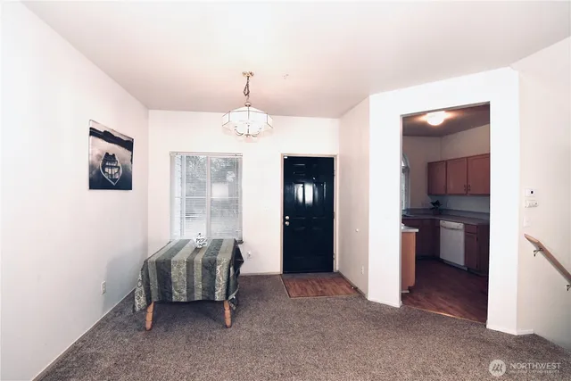 a view of a livingroom with furniture and windows