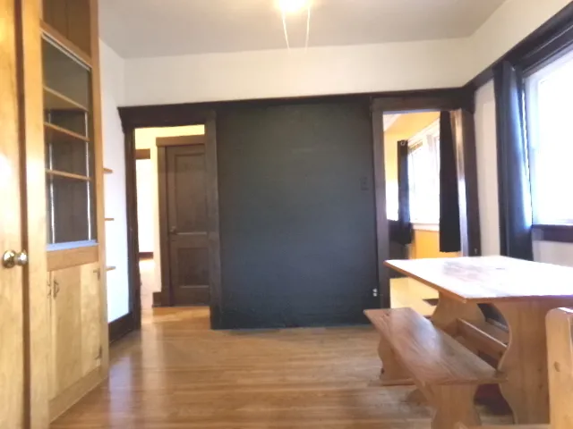 a dining room with a table and chairs