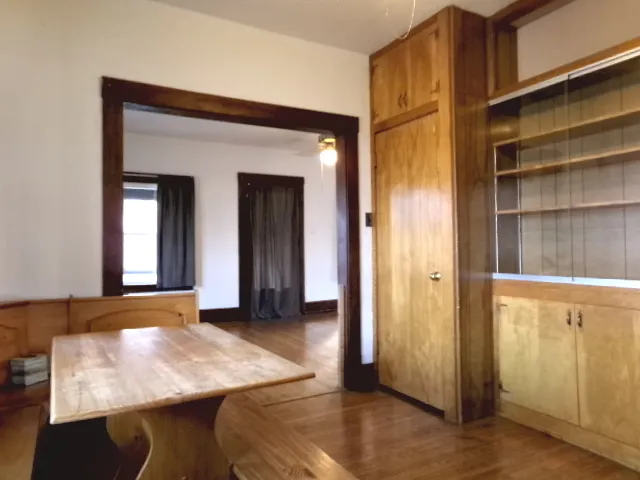 a room that has a bed and a dresser in it