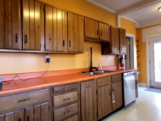 a kitchen with stainless steel appliances granite countertop a sink and cabinets