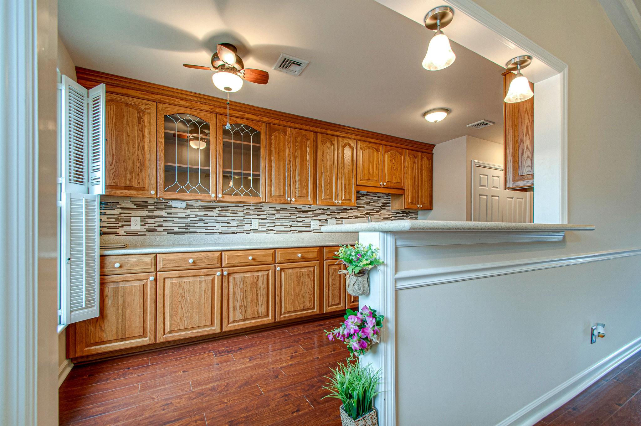 1009 General George Patton Road Nashville, TN 37221 - Photo 12 of 30 Kitchen has been updated with new countertops, tile backsplash, stainless appliances and undermount sink