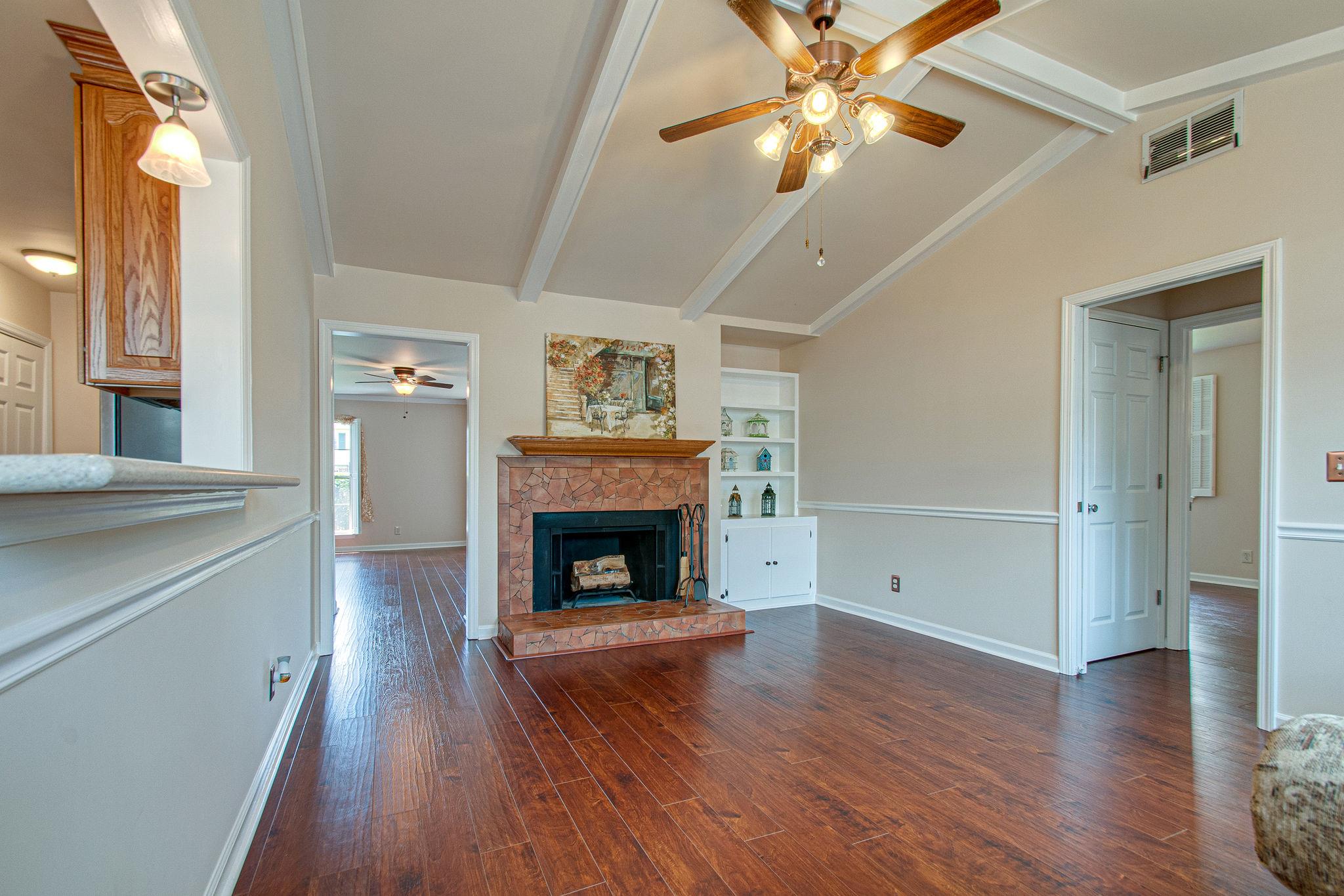 1009 General George Patton Road Nashville, TN 37221 - Photo 8 of 30 Den with wood burning fireplace and vaulted ceiling