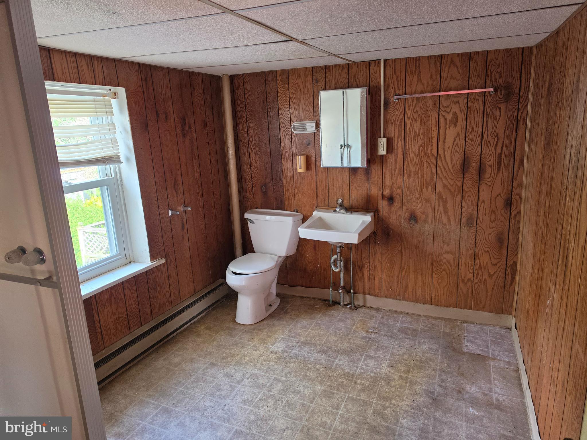 6018 Conover Road Taneytown, MD 21787 - Photo 12 of 18 a bathroom with a sink toilet and shower