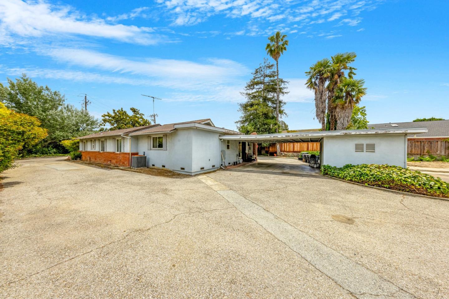 18455 Old Monterey Road Morgan Hill, CA 95037 - Photo 12 of 26 a front view of house with a yard and trees in the background