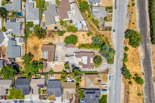 an aerial view of residential houses with outdoor space