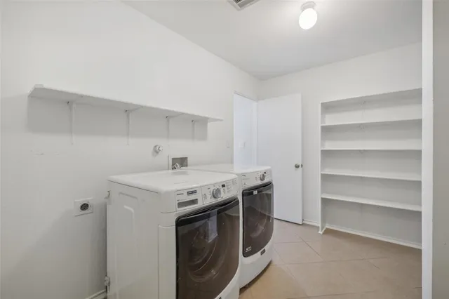 a utility room with washer and dryer