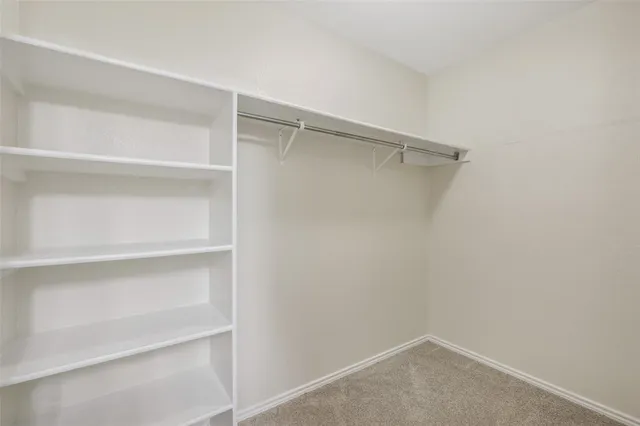 a view of an empty walk in closet