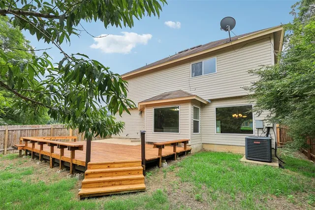 a view of a backyard of the house