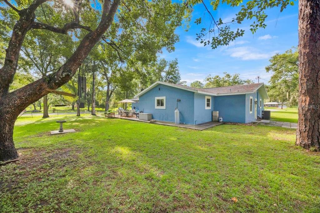 34159 Ridge Manor Boulevard Dade City, FL 33523 - Photo 21 of 33 a view of a house with a yard