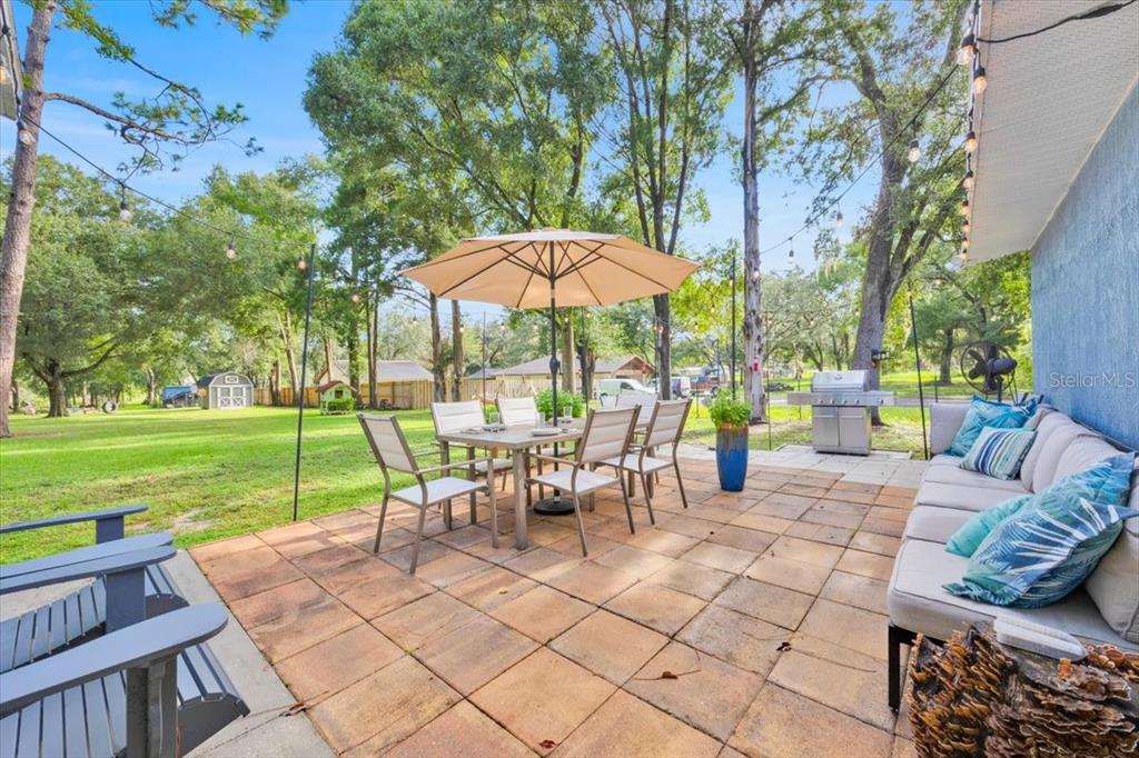 34159 Ridge Manor Boulevard Dade City, FL 33523 - Photo 23 of 33 a view of a backyard with sitting area