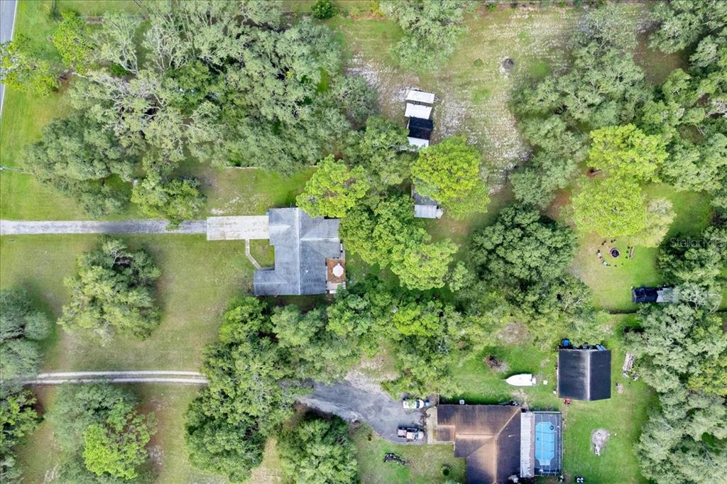 34159 Ridge Manor Boulevard Dade City, FL 33523 - Photo 31 of 33 an aerial view of a house with outdoor space and street view