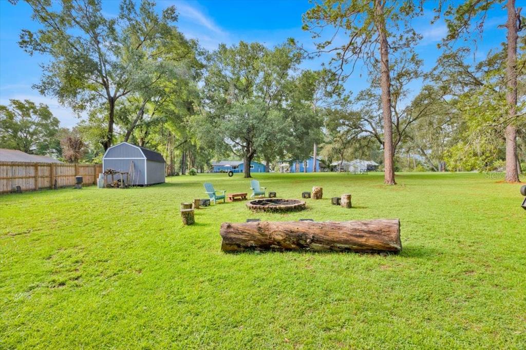 34159 Ridge Manor Boulevard Dade City, FL 33523 - Photo 32 of 33 a front view of a house with garden