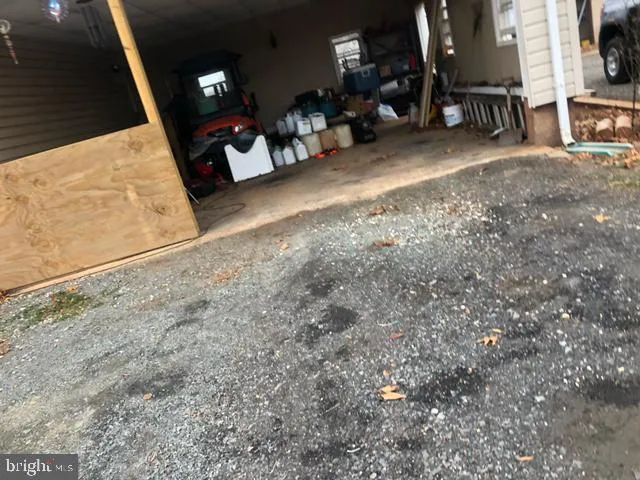 a view of a house with a yard and garage