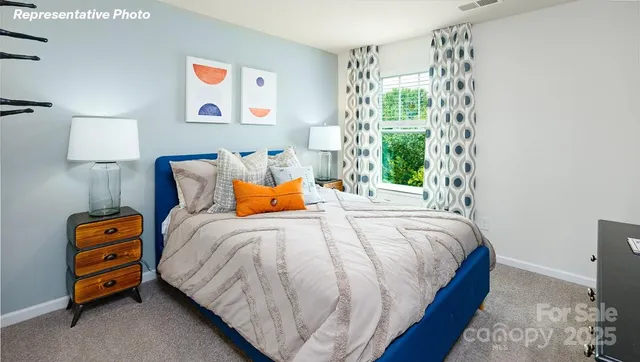 a bedroom with bed and a window