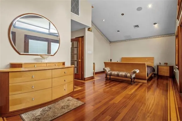 a living room with furniture and a mirror